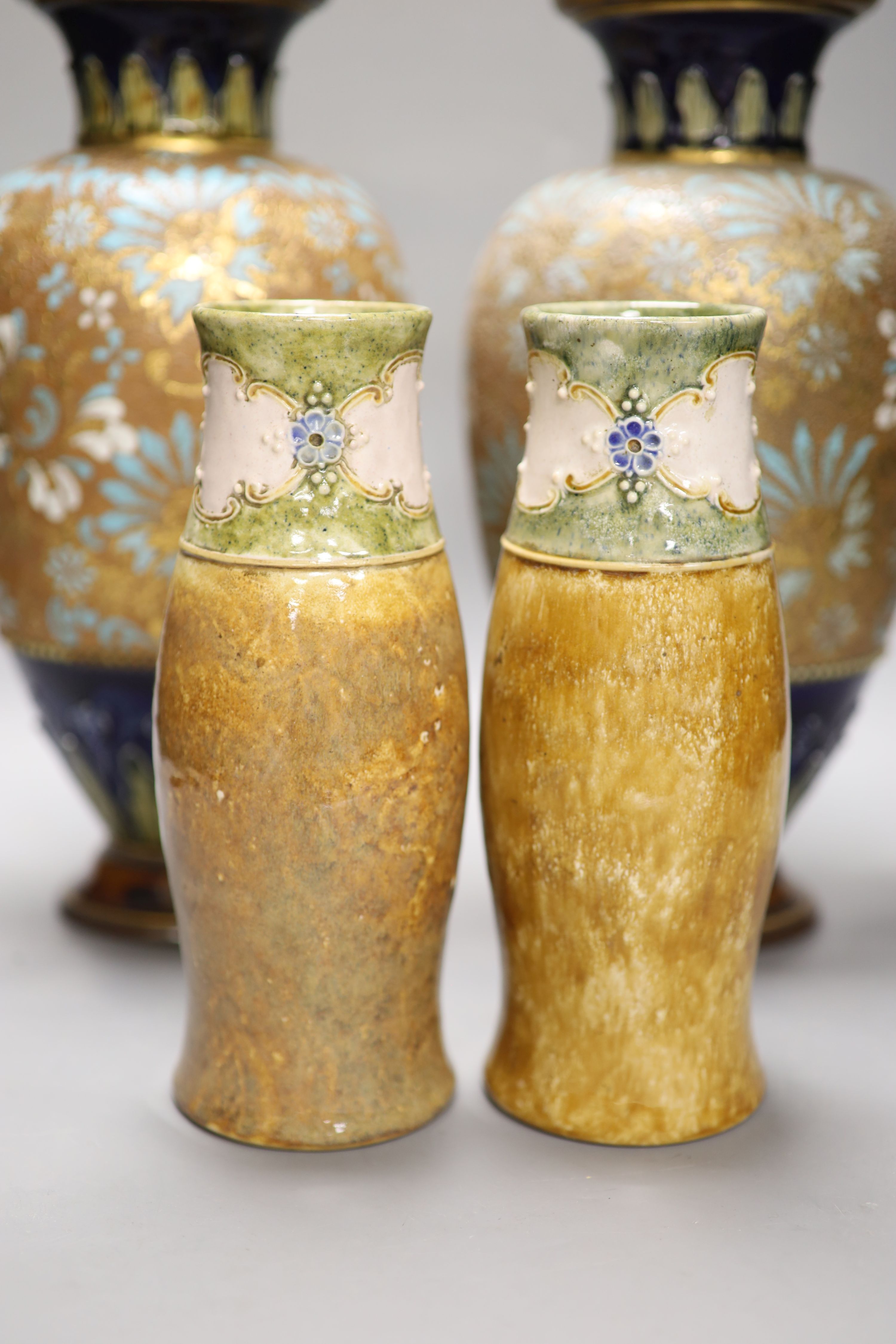 A pair of Royal Doulton Art Nouveau ovoid tubelined vases, impressed number 8079, monogram WB and a pair of Slaters Patent vases, hei